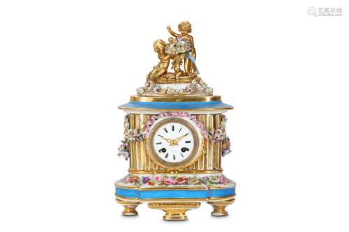 A LATE 19TH CENTURY FRENCH PORCELAIN MANTEL CLOCK BY DIXON & CO. PARISthe case modelled as an oval fluted column on a plinth base with floral decoration