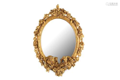 A 19TH CENTURY GILTWOOD AND GESSO OVAL GIRANDOLE MIRRORthe oval frame naturalistically modelled as a branch and with a oak and acorn border and cresting