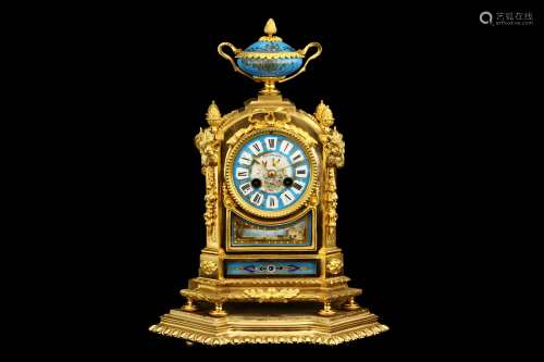 A LATE 19TH CENTURY FRENCH GILT BRONZE AND PORCELAIN MOUNTED MANTEL CLOCK the case of arched form surmounted by a twin handled urn with fruiting finial