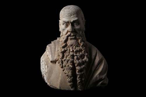 AN IMPORTANT LATE 15TH CENTURY ITALIAN CARVED SANDSTONE BUST OF A BEARDED MAN