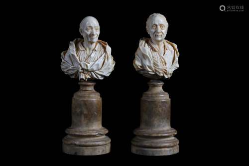 CLAUDE ANTOINE ROSSET (D. 1818): A PAIR OF LATE 18TH CENTURY CARVED IVORY BUSTS OF VOLTAIRE AND MONTESQUIEU each on an associated cylindrical alabaster pedestal; Voltaire signed to the reverse 'A:ROSSET. á St. Claude'