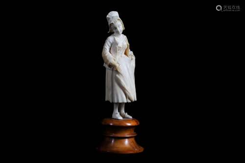 A 19TH CENTURY FRENCH (DIEPPE) CARVED IVORY FIGURE OF A YOUNG PEASANT GIRLwearing a hat