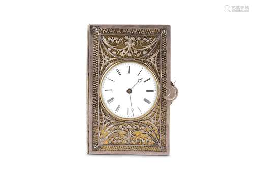 A 19TH CENTURY SILVER AND GILT WATCH HOLDER MODELLED AS A BOOK CIRCA 1867with filigree decoration to both sides