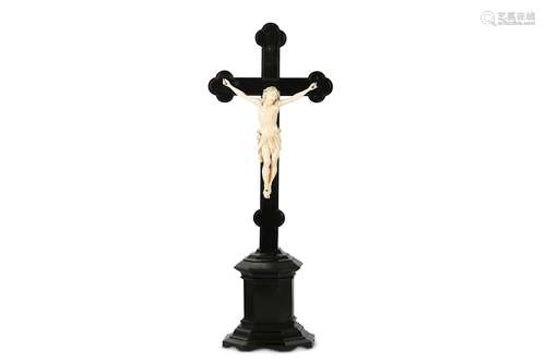 A 19TH CENTURY CARVED IVORY AND EBONY CRUCIFIX the Corpus Christi figure of Christ depicted wearing the crown of thorns