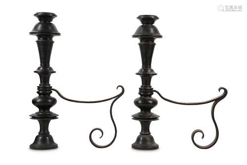 A PAIR OF BRONZE AND WROUGHT IRON JACOBEAN STYLE FIRE ANDIRONS