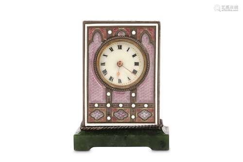 AN EARLY 20TH CENTURY SILVER AND ENAMELLED MINIATURE TRAVELLING CLOCK IN THE ART NOUVEAU STYLEthe rectangular case decorated with Gothic arches and quatrefoils