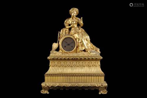 AN EARLY 19TH CENTURY FRENCH EMPIRE PERIOD GILT BRONZE FIGURAL MANTEL CLOCK IN THE OTTOMAN TASTEthe gadrooned and stepped plinth base surmounted by a figure of a Orientalist maiden holding a posey of flowers and reclining against a tree stump