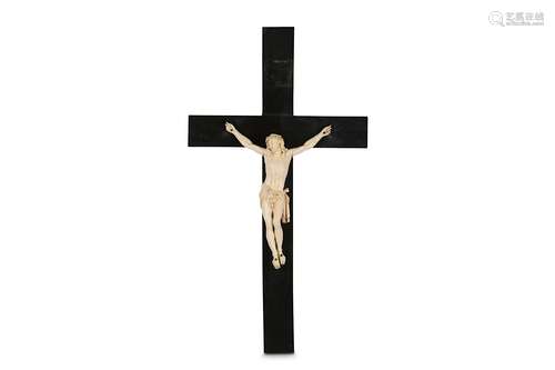 A 19TH CENTURY CARVED IVORY CRUCIFIXthe Corpus Christi figure of Christ depicted wearing the crown of thorns