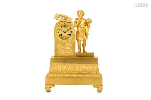 A SMALL EARLY 19TH CENTURY EMPIRE PERIOD GILT BRONZE MANTEL CLOCK DEPICTING A YOUTHthe classically attired young boy holding a cornucopia