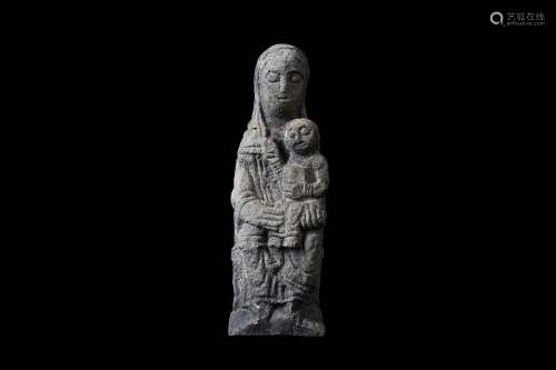 A CARVED STONE FIGURE OF THE MADONNA AND CHILD