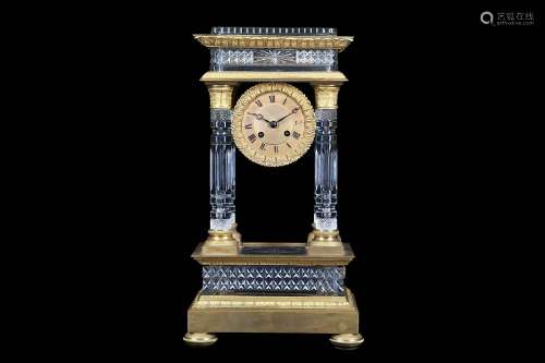 A 19TH CENTURY FRENCH ROCK CRYSTAL STYLE GLASS AND GILT BRONZE PORTICO CLOCK ATTRIBUTED TO BACCARATthe cut glass cornice supported on four free standing columns with acanthus capitals