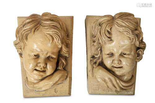 A PAIR OF LATE 19TH CENTURY GLAZED TERRACOTTA CHERUB MASK KEYSTONES BY LIPSCOMBE & CO. AFTER THE MODEL BY FRANCOIS DUQUESNOY (FLEMISH