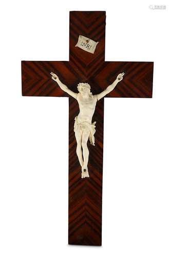 A 19TH CENTURY FRENCH / ITALIAN CARVED IVORY CRUCIFIX ON CALAMANDER VENEERED CROSSthe ivory Corpus Christi with eyes open and wearing the crown of thorns