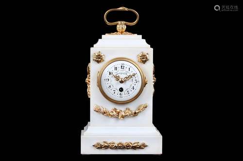 A LATE 19TH CENTURY FRENCH WHITE MARBLE AND GILT BRONZE MOUNTED MANTEL CLOCK RETAILED BY WARING & GILLOWin the Louis XVI taste