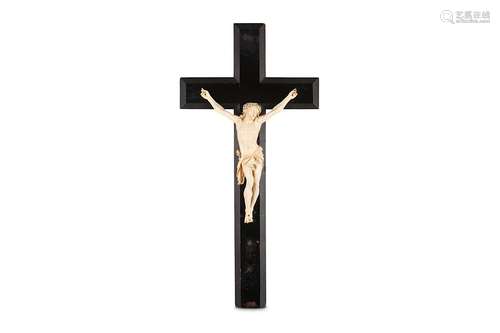 A 19TH CENTURY CARVED IVORY CRUCIFIXthe Corpus Christi figure of Christ depicted wearing the crown of thorns