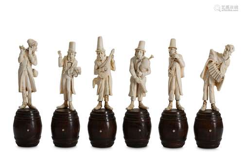 A SET OF SIX LATE 19TH CENTURY GERMAN CARVED IVORY FIGURES OF MUSICIANSthe musical band all raised on carved and stained wood plinths modelled as barrels