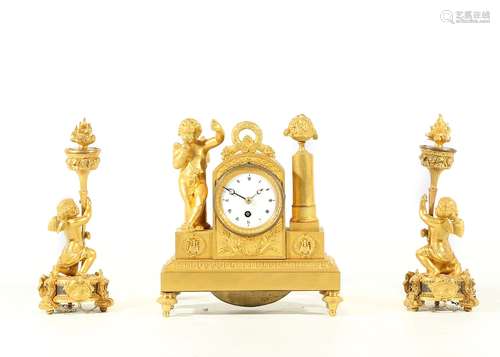 A SMALL MID 19TH CENTURY FRENCH GILT BRONZE FIGURAL CLOCK GARNITURE the clock with an arched case raised on a plinth base and four toupie feet