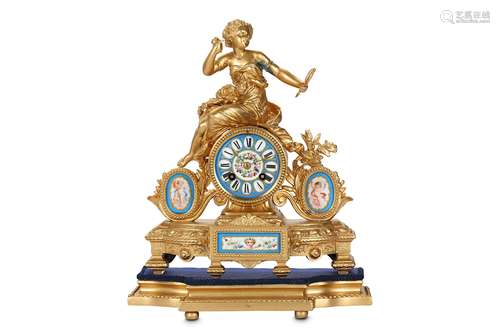 A LATE 19TH CENTURY FRENCH GILT METAL AND PORCELAIN MOUNTED MANTEL CLOCKthe drum case raised on a shaped plinth surmounted by a pair of oval porcelain panels depicting cherubs and a maiden looking into a hand mirror