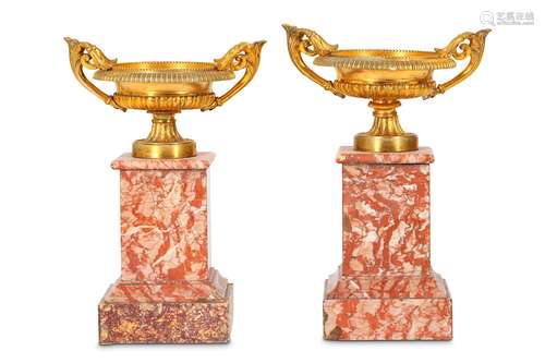 A PAIR OF LATE 19TH CENTURY FRENCH GILT BRONZE AND COLOURED MARBLE TAZZASthe squat urns with scrolling twin handles