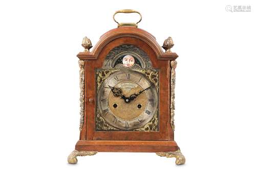 A GEORGE III STYLE BURR WALNUT AND BRASS MOUNTED TABLE CLOCK the case of breakarch form surmounted by a brass handle