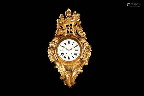 A LARGE EARLY 20TH CENTURY GEORGE III STYLE GILTWOOD CARTEL CLOCK the case of Rococo design with scrolling foliage