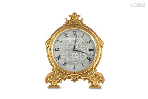 A MID 19TH CENTURY ENGRAVED GILT BRASS STRUT CLOCK IN THE MANNER OF THOMAS COLE the circular frame surmounted by an Arabesque crest and raised on conforming scrolling feet