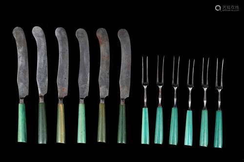 A SET OF TWELVE 18TH CENTURY GREEN STAINED IVORY AND STEEL KNIVES AND FORKSthe forks with sharply pointed tines