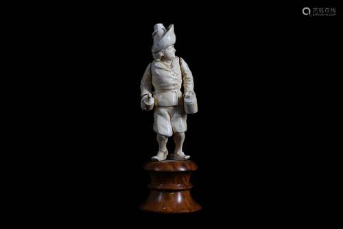 A LATE 18TH / EARLY 19TH CENTURY GERMAN IVORY FIGURE OF A PEASANTwearing clogs and holding a bottle in his right hand