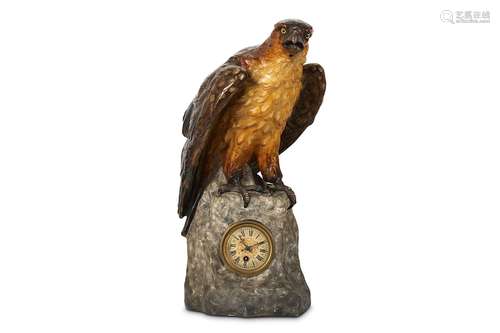 A FIRST HALF 20TH CENTURY AUSTRIAN PAINTED CLOCK MODELLED WITH AN EAGLEraised on a rocky plinth base