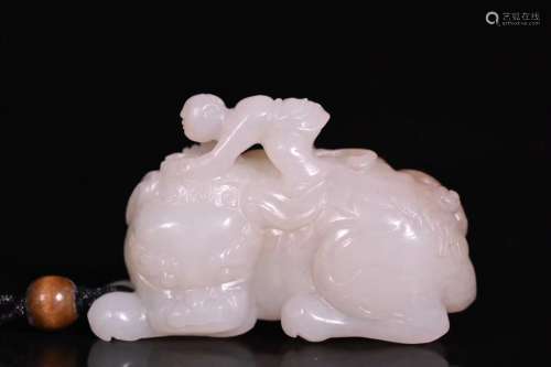 A Carved Hetian Jade Child with Lion