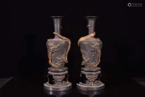 A Pair of Carved Silver Dragon Vases