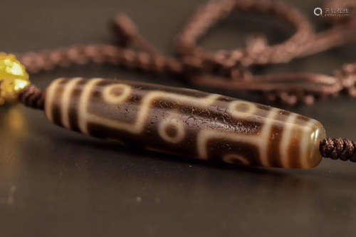 A NINE-EYE DZI BEAD