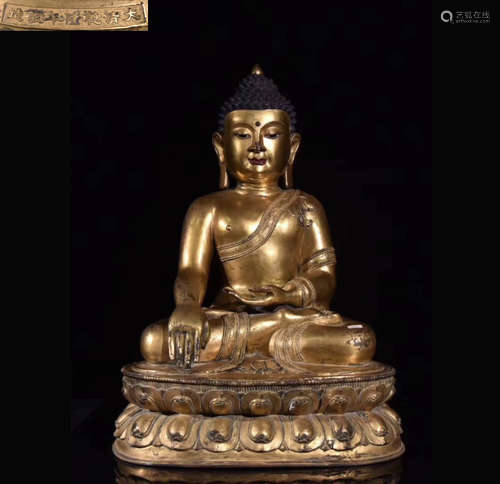 A GILT BRONZE MOLDED BUDDHA STATUE