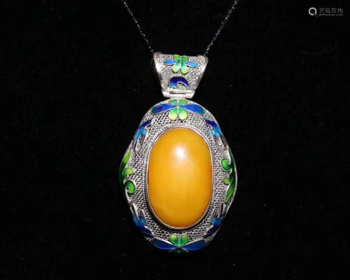 A MILA AMBER ENAMELED PENDANT