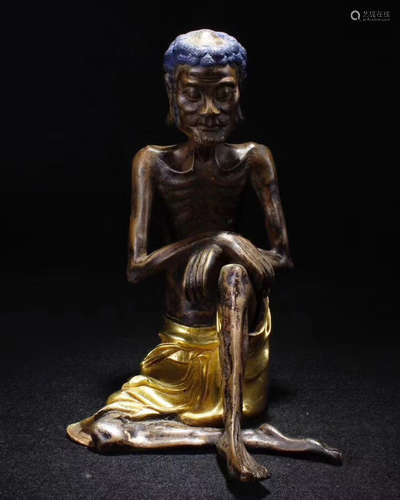 A BRONZE GILT SKINNY MONK