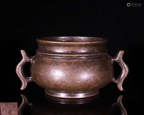 A BRONZE MOLDED DOUBLE-EAR CENSER