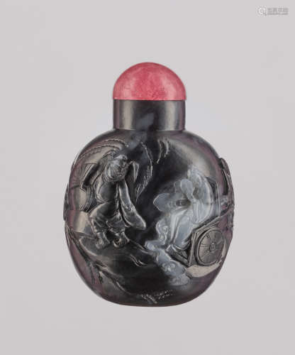 A BLACK AND WHITE ‘ZHONG KUI’ JADE SNUFF BOTTLE, QING D…