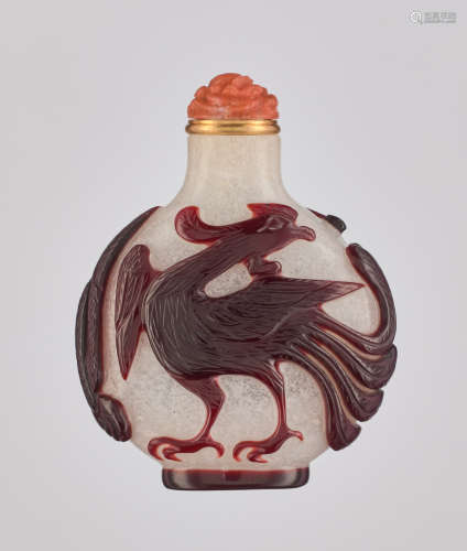 A RUBY RED OVERLAY WHITE GLASS 'DRAGON AND PHOENIX' SNU…