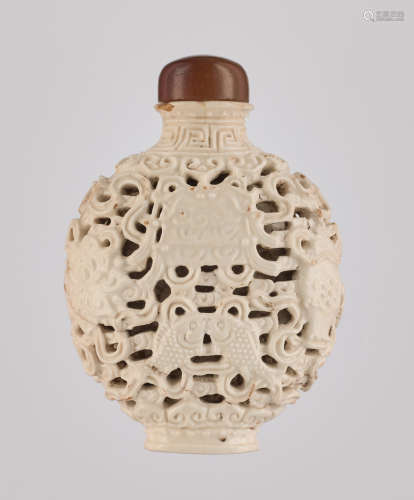 A RETICULATED WHITE PORCELAIN 'BA JIXIANG' SNUFF BOTTLE