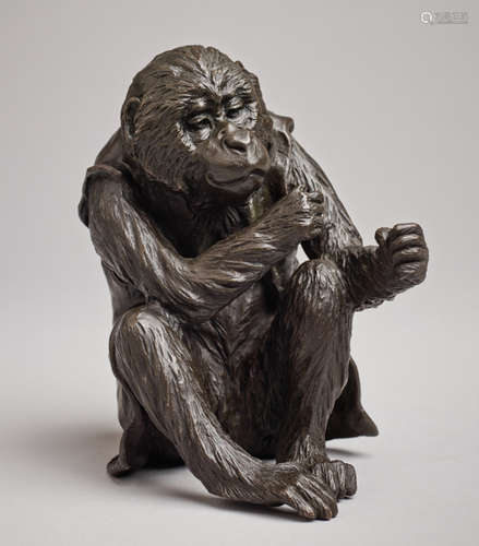 A BRONZE OKIMONO OF A SITTING APE BY IKKOBronze...