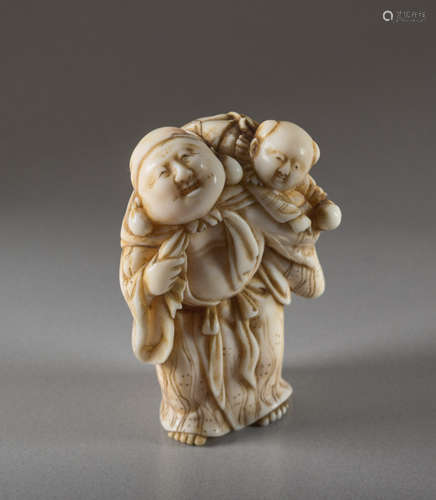 AN IVORY NETSUKE OF HOTEI WITH KARAKOIvory nets...