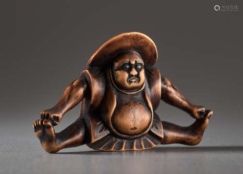 A WOOD NETSUKE BY HIDEHARU OF A SPARROW DANCERW...