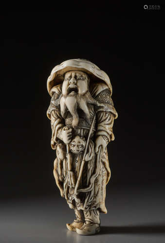 AN IMPORTANT TALL IVORY NETSUKE OF A MONGOLIAN ARC...