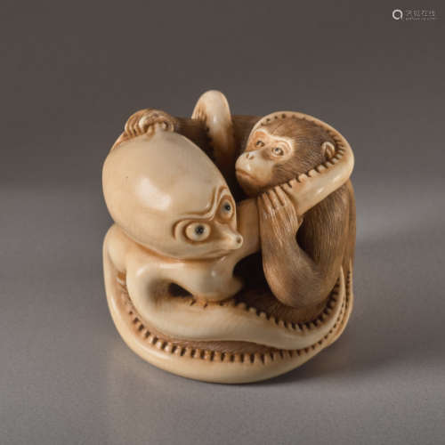 AN IVORY NETSUKE BY IKKOSAI TOUN OF A MONKEY AND O...