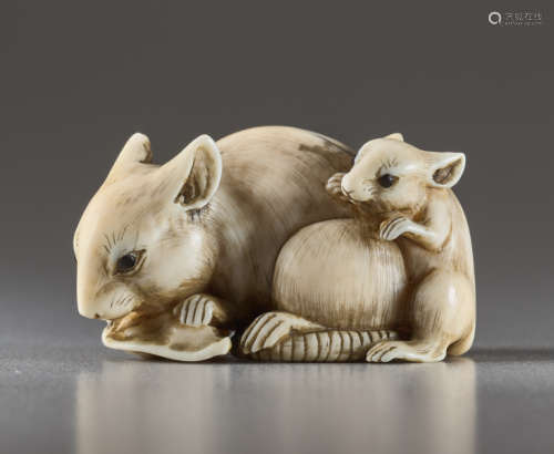 AN IVORY NETSUKE BY TOMOKAZU OF TWO RATSIvory n...