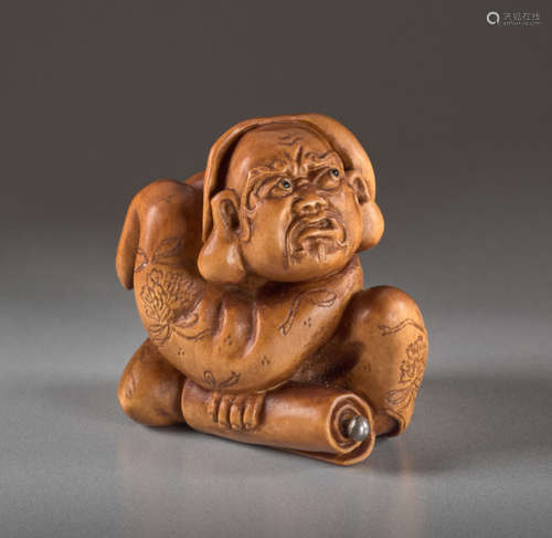 A BOXWOOD NETSUKE BY ALEXANDER DERKACHENKO OF DARU...