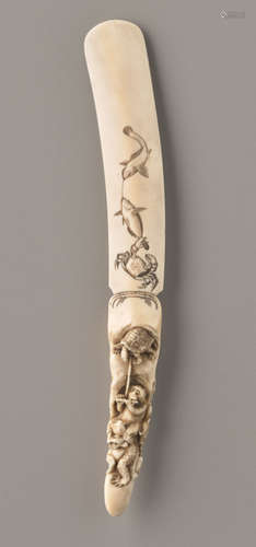 AN IVORY LETTER OPENER WITH MONKEY, TURTLE, FROG, ...