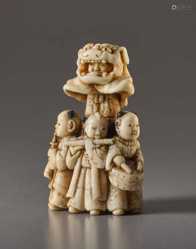 AN IVORY NETSUKE OF THE LION DANCE SHISHIMAIIvo...