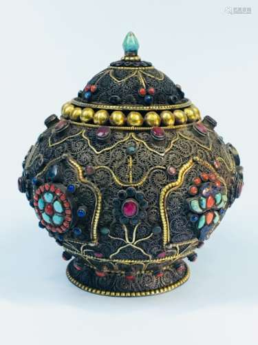 A GILT SILVER JAR AND COVER
