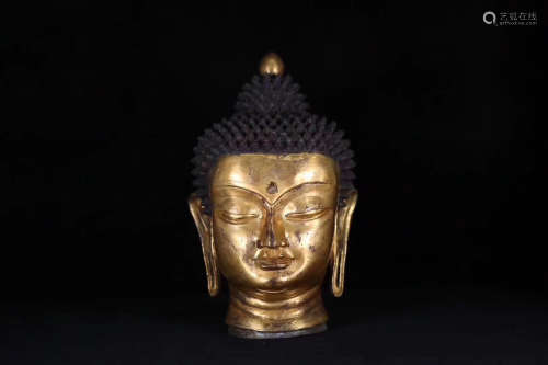 A MING DYNASTY TIBETAN GILT BUDDHA'S HEAD